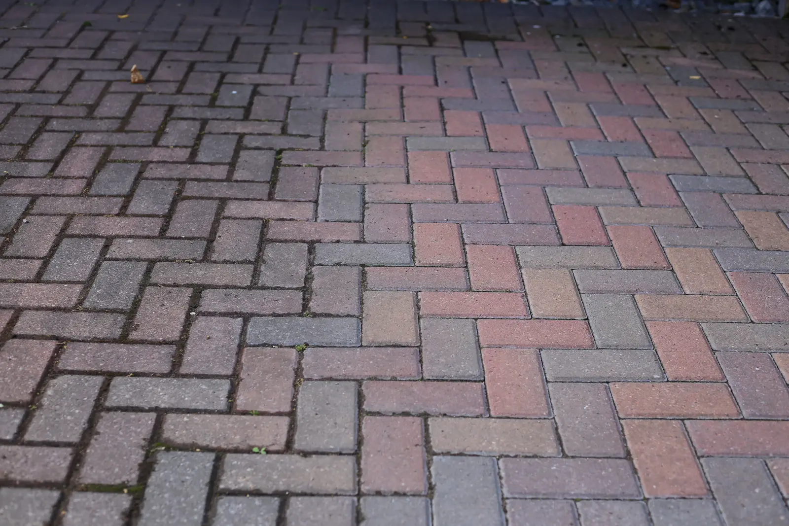 Clean red herringbone block paving