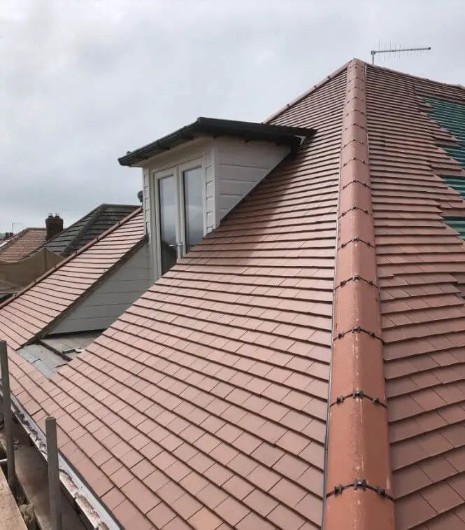 New dry fix ridge on a plain tiled roof