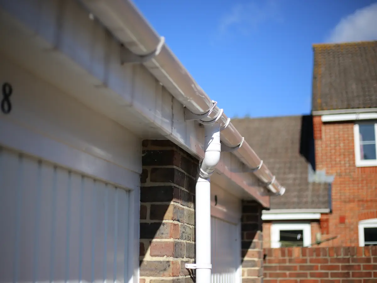 White uPVC fascia and gutter over a row of garages